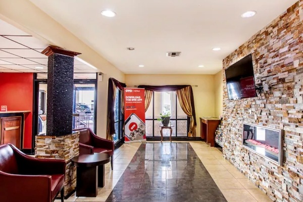 Unwind in the lounge with cozy seating and warm fireplace.