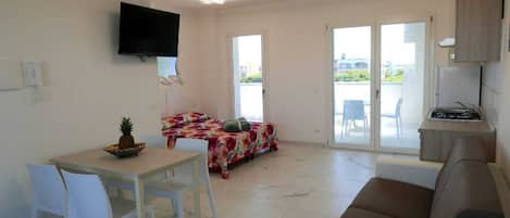 Studio, plusieurs chambres, balcon, vue sur la ville | Salle de séjour