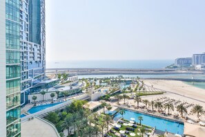 A hotel with a pool, beach, and ocean view. - Al Bateen Ultra Luxe 5BR I Private Beach (Dubai)