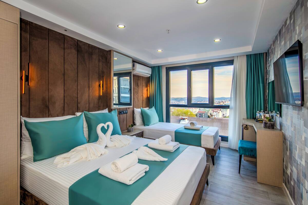 Quarto triplo luxo, vista para a cidade | Vista do quarto
