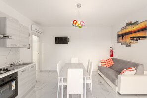 Apartment, 1 Bedroom, Balcony | Living room - Modern Flat With Shared Pool and Terrace (San Michele al Tagliamento)