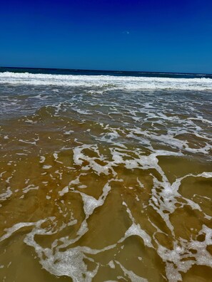 On the beach, sun loungers, beach towels
