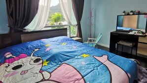 A bedroom with a bed, a desk, a chair, a TV, and a window with curtains. - Valley Mountain View&City Proximity
 1 bedroom 1 living room 1kitchen 1 toilet (Phuket)