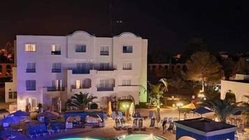 Indoor pool, outdoor pool, pool umbrellas, sun loungers