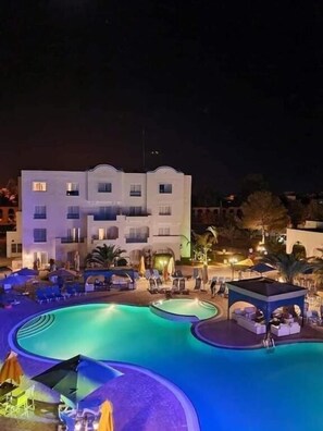 Indoor pool, outdoor pool, pool umbrellas, sun loungers