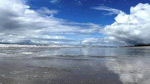 A beach with a clear sky and waves. - Playa Caracol, a Happy Beach (Punta Chame)
