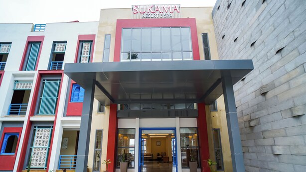 A modern building with a sign reading "SUKAMVA RESORT & SPA". - Sukama Resort & Spa (Dhari)