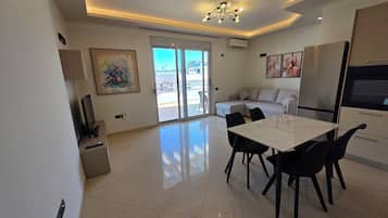 Family Apartment, Partial Sea View | Living area