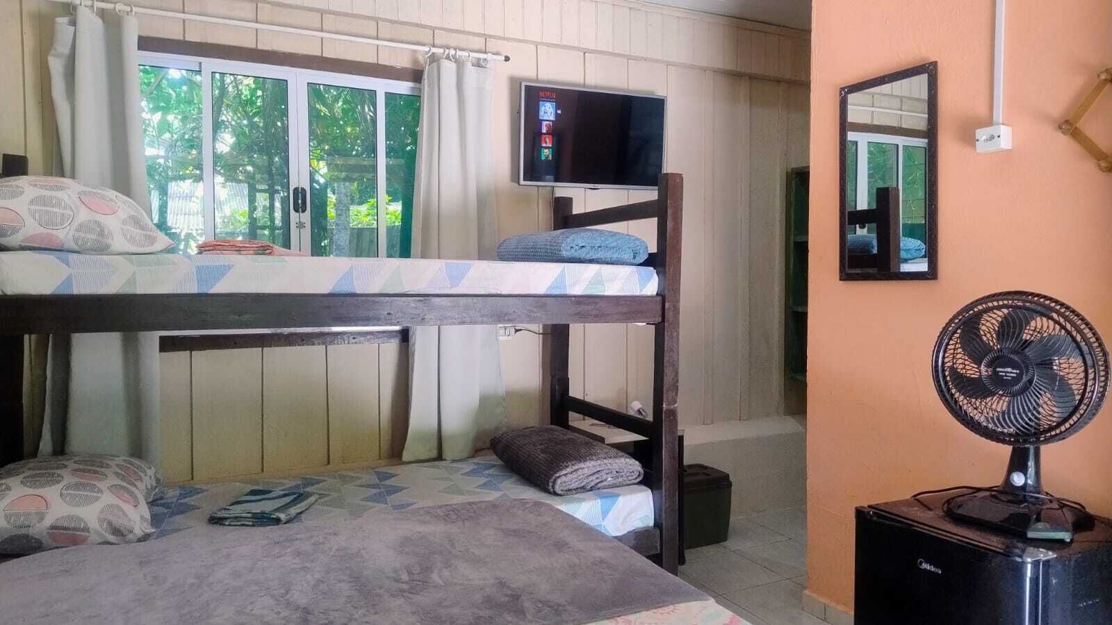 Classic Quadruple Room, Multiple Beds, Private Bathroom, Beachside | Laptop workspace, free WiFi, bed sheets