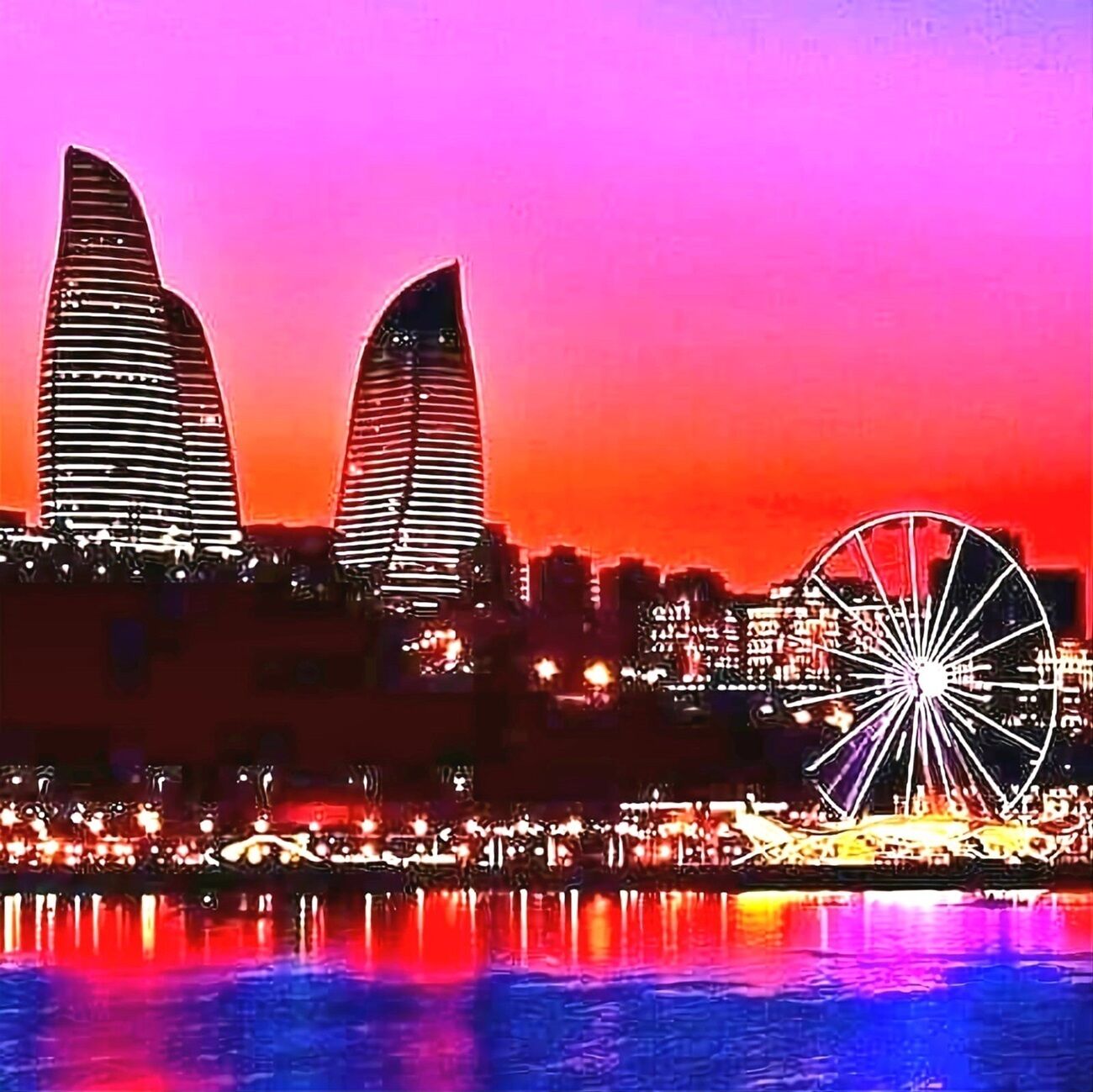 A cityscape at dusk with illuminated buildings and a large Ferris wheel reflecting on the water.