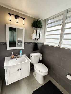 Hair dryer, towels, soap, toilet paper - Borinqueen Bliss  1-bedroom apartment  with pool in vibrant Condado (Condado)