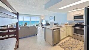 A modern kitchen with a built-in microwave, oven, and dishwasher. - Enjoy Stunning Gulf Front Cabana Club 304! Private balcony with beautiful views! (Destin)