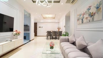 Deluxe Apartment, 3 Bedrooms, Non Smoking, City View | Living area | 24-inch flat-screen TV with digital channels