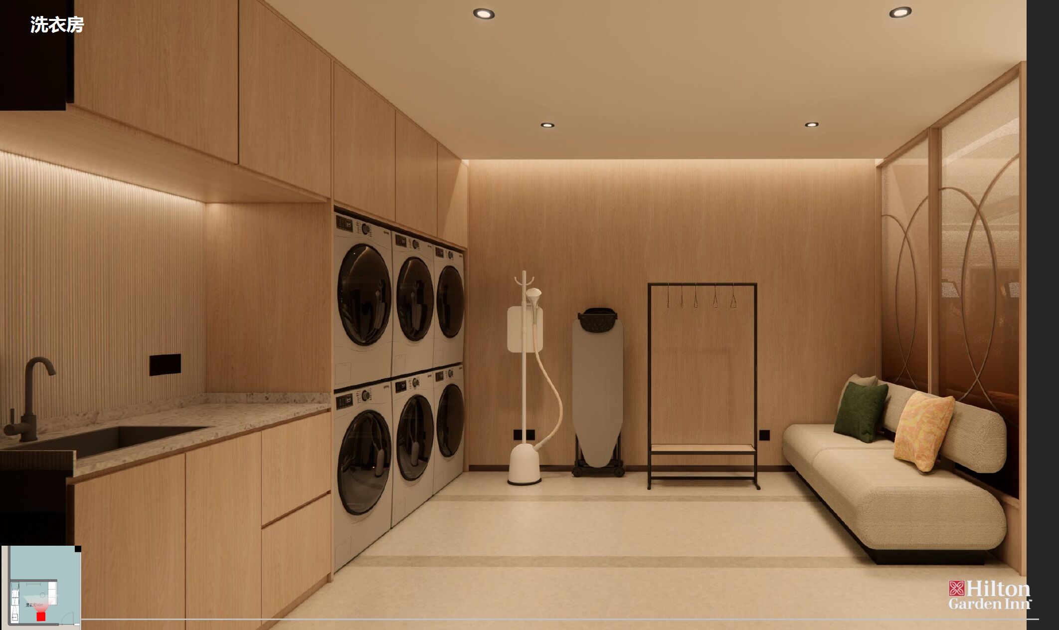 A modern laundry room with a built-in washer and dryer, a sink, and a seating area with a sofa and pillows.