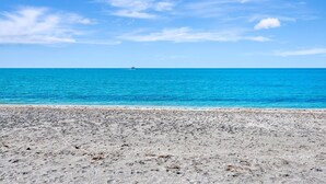 A beach with a clear sky and calm sea. - 3BR Gulf-Front Luxury with Panoramic Views (Englewood)