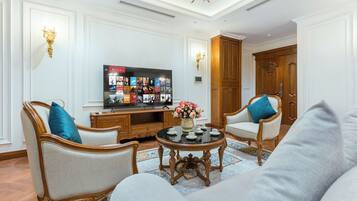 Family Suite, City View | Living area | 60-inch TV with cable channels