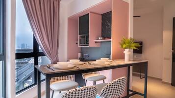 Deluxe Apartment, City View | Private kitchen | Fridge, microwave