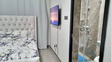 Shower, hair dryer, towels, soap