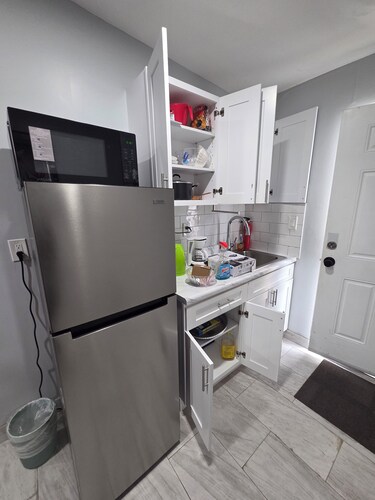 At home in this new mini apartment with a private bath& a new royal queen bed,