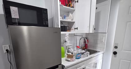 At home in this new mini apartment with a private bath& a new royal queen bed,