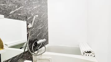 Shower, hair dryer, towels, shampoo