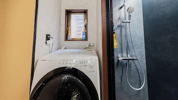Shower, hair dryer, towels, shampoo