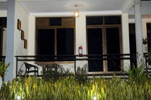 A building facade with large windows, a fire extinguisher mounted on the wall, and a balcony with a railing. - Lovely 2-bedroom apartment in vibrant Kigali perfect for your stay (Kigali)