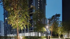 An outdoor patio area with wooden flooring, a table with chairs, and a small bar area. - Comfy Damansara Petaling Jaya 3BR2B  (Petaling Jaya)