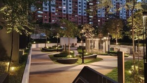 A residential area with high-rise buildings, a well-lit pathway, and landscaped gardens. - Comfy Damansara Petaling Jaya 3BR2B  (Petaling Jaya)
