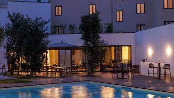 Seasonal outdoor pool, pool umbrellas, pool loungers