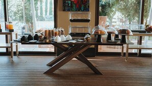 A breakfast buffet with various food items and a coffee station. - Antum Hotel (Benevento)