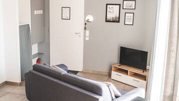 Standard Apartment, 1 Bedroom | Living area | TV