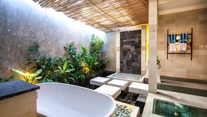 A modern bathroom with a freestanding bathtub, a shower area, and a small pool. - SPV Nusa Dua Luxury Traditional Design Nusa Dua (Nusa Dua)