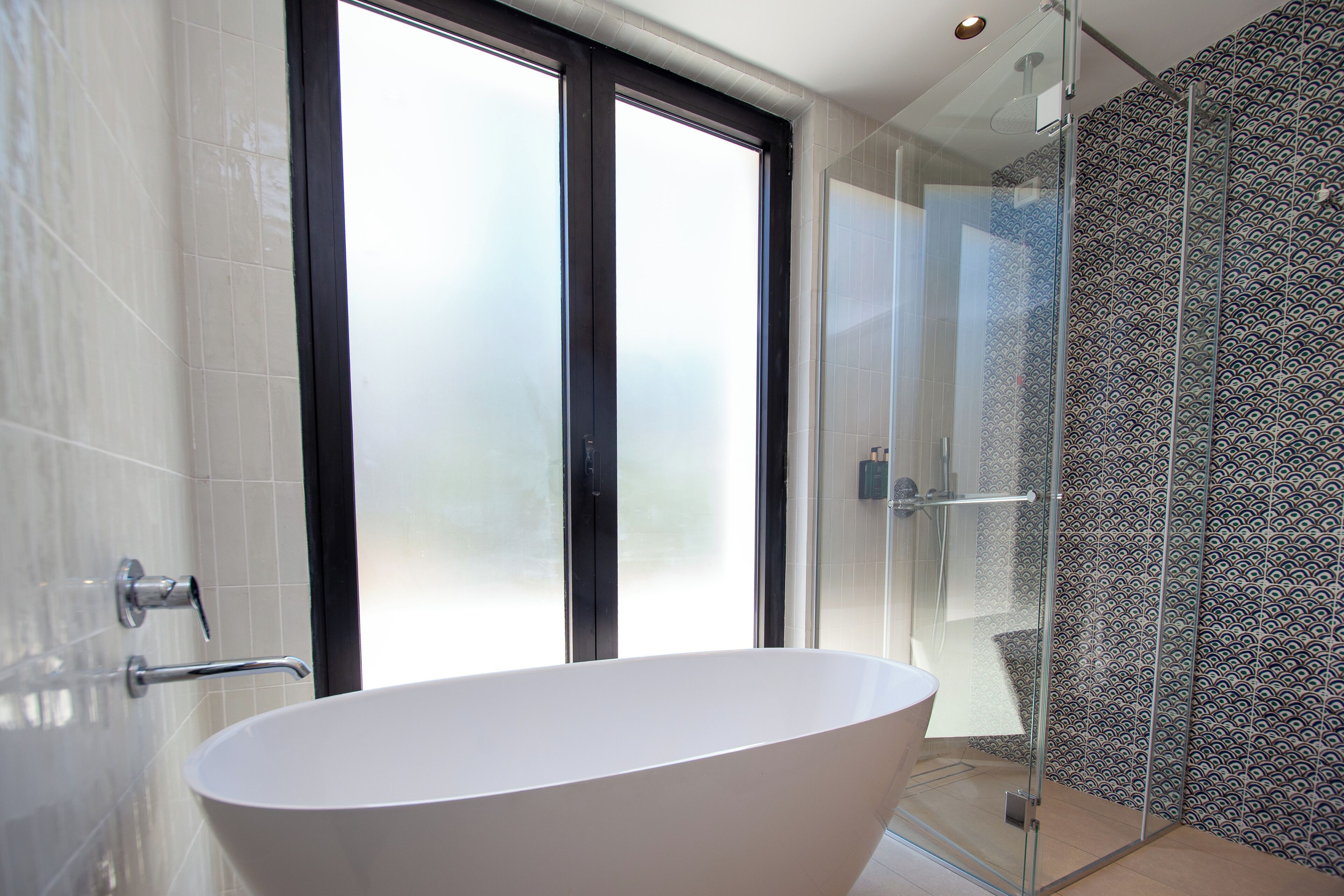Deluxe Studio Suite | Bathroom | Hair dryer, slippers, towels