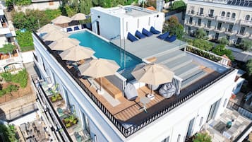 Seasonal outdoor pool, pool umbrellas, pool loungers
