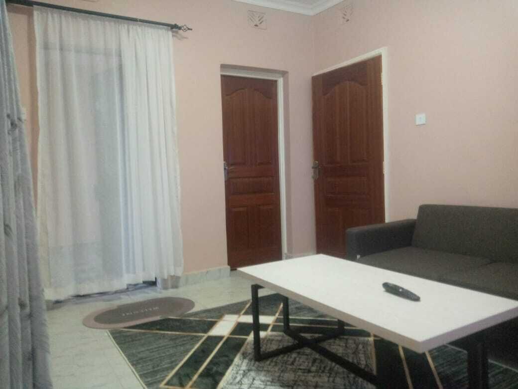 Deluxe Apartment | Living area | 32-inch Smart TV with digital channels