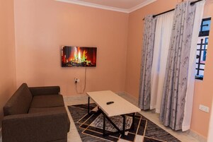 Family Apartment | Living area | 32-inch Smart TV with digital channels