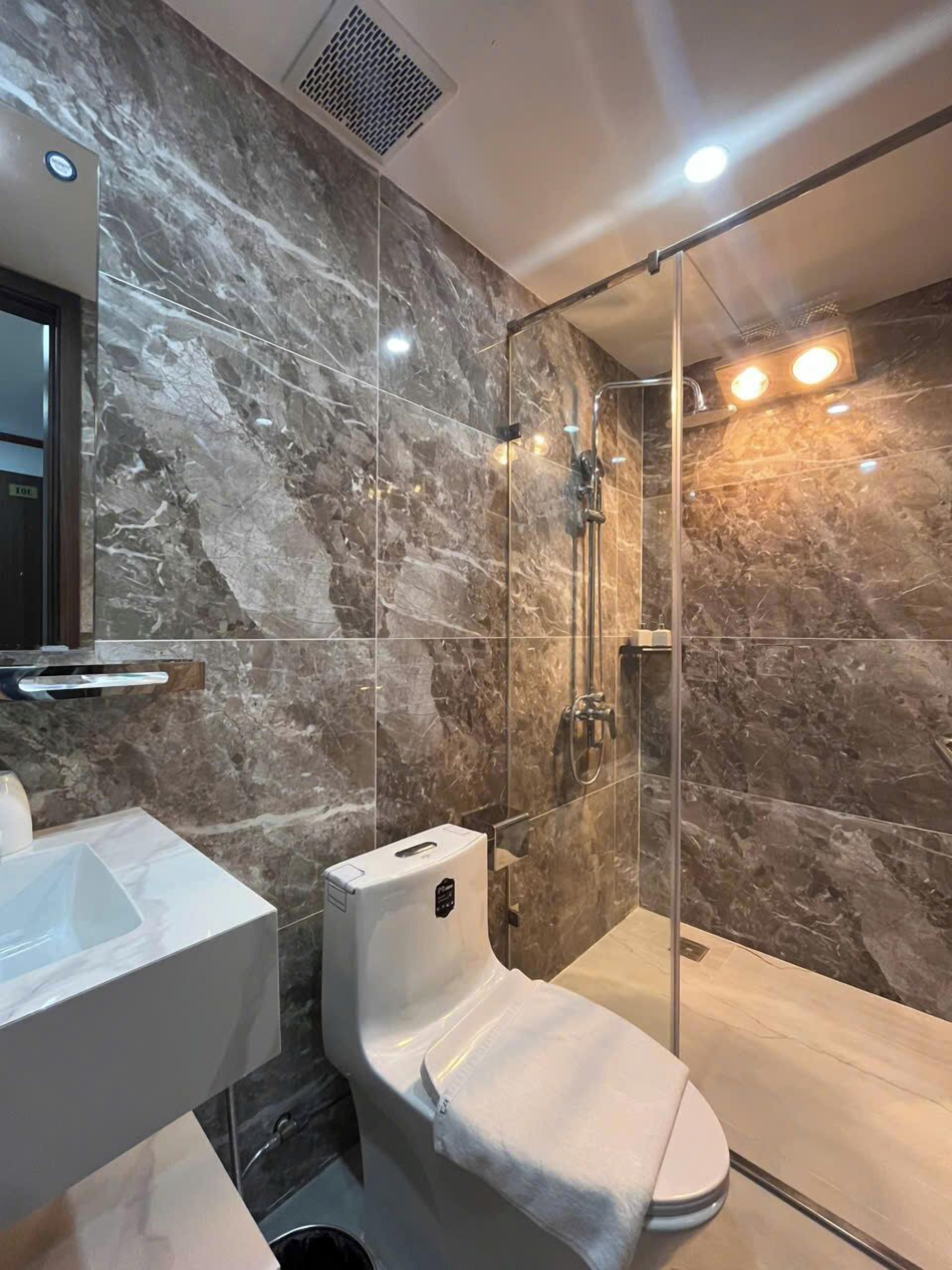 Shower, designer toiletries, hair dryer, bathrobes