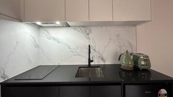 Mini-fridge, microwave, stovetop, cookware/dishes/utensils