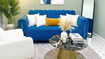 Deluxe Apartment | Living area | 32-inch Smart TV with digital channels