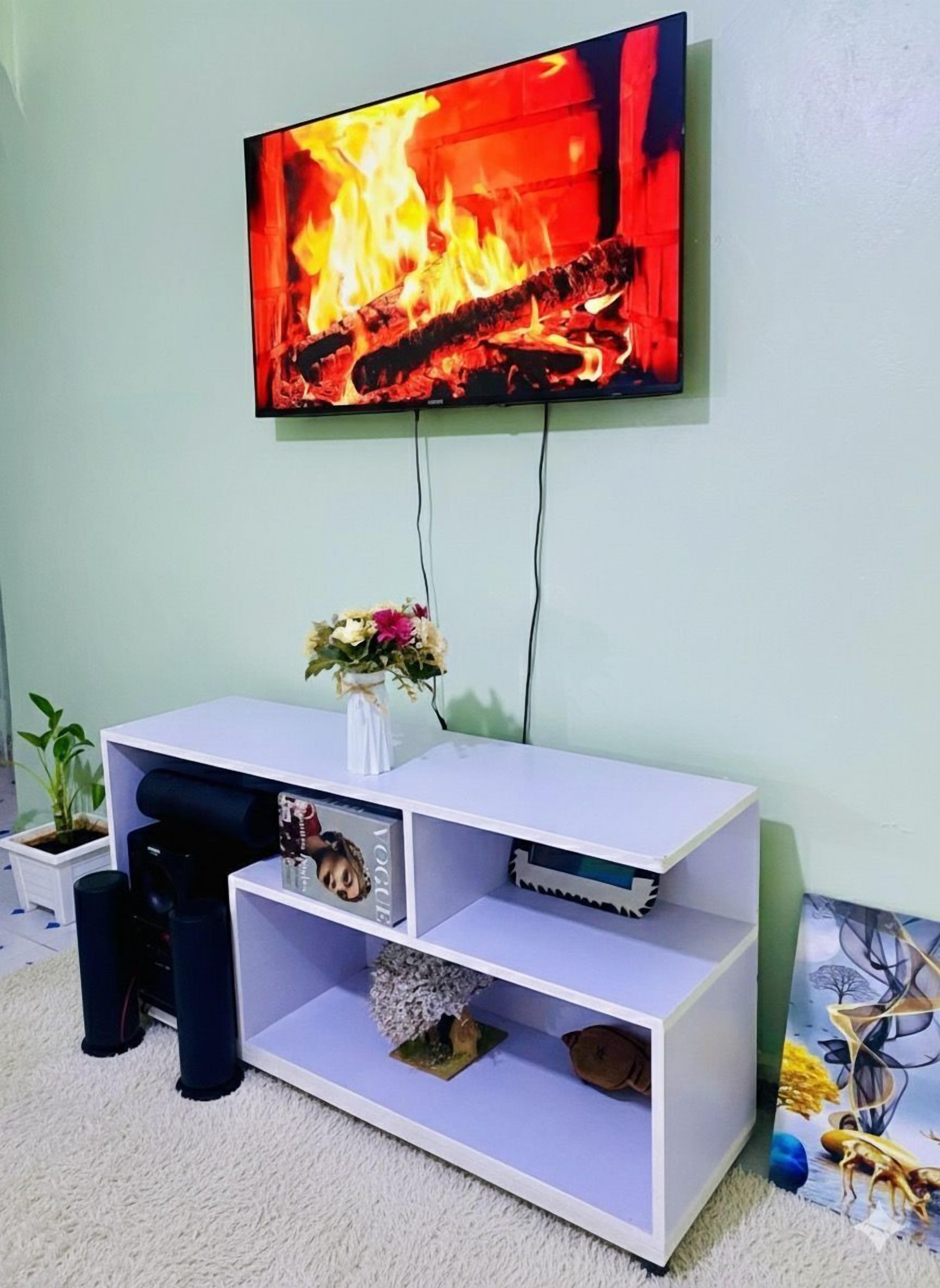 Deluxe Apartment | Living area | 32-inch Smart TV with digital channels