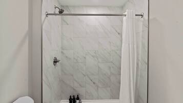 Shower, hair dryer, towels, shampoo