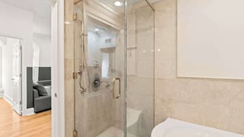 Shower, hair dryer, towels, shampoo