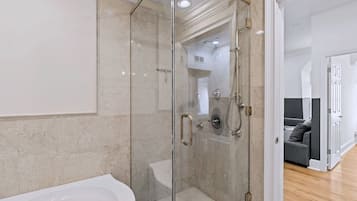 Shower, hair dryer, towels, shampoo