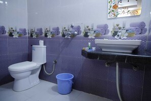 Shower, free toiletries, slippers, towels