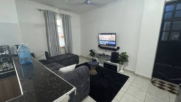 Comfort Apartment | Living area | 32-inch Smart TV with digital channels