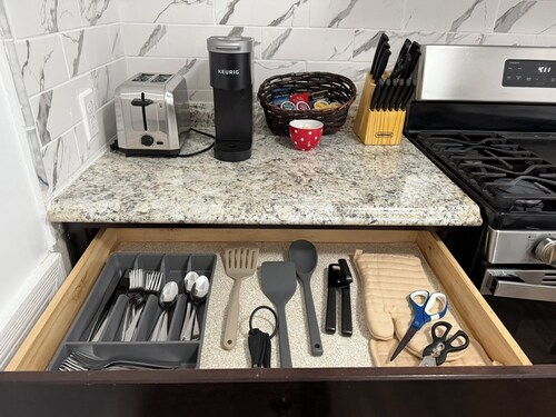 This is a 3 bedroom, 1 - 1/2 bath apartment on the top two floors of a triplex home. It has a living room and kitchen, and 3 bedrooms. There are 2 queen beds and one trundle bed to sleep 6 comfortably. There is a full kitchen and a washer and dryer.