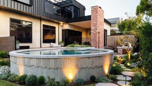 A modern house with a swimming pool, a brick chimney, and a well-maintained garden. - Helix in Mornington With 4 Bedrooms and 3 5 Bathrooms (Melbourne)