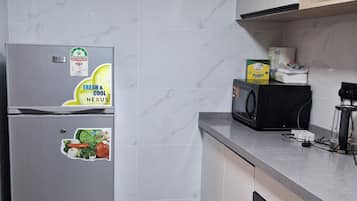 Fridge, microwave, cookware/dishes/utensils