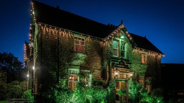 A stone building with a sign reading "The Pambers Inn." - Rambler Inn (Hope Valley)
